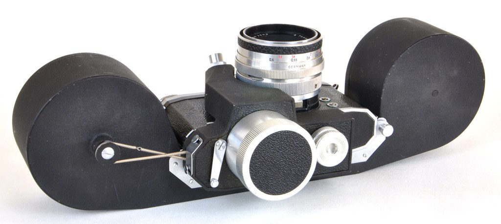 How the clockwork motor drive advanced film in the film back, fitted to a Praktina FX