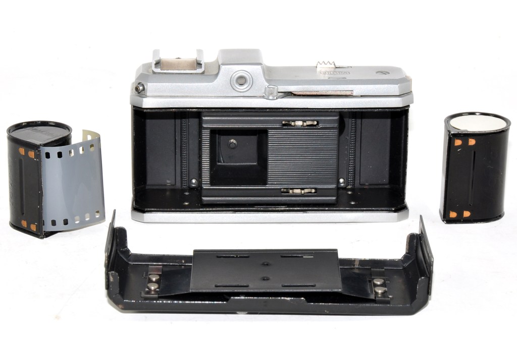 Inside the camera with the back removed along with its twin-cassette film system