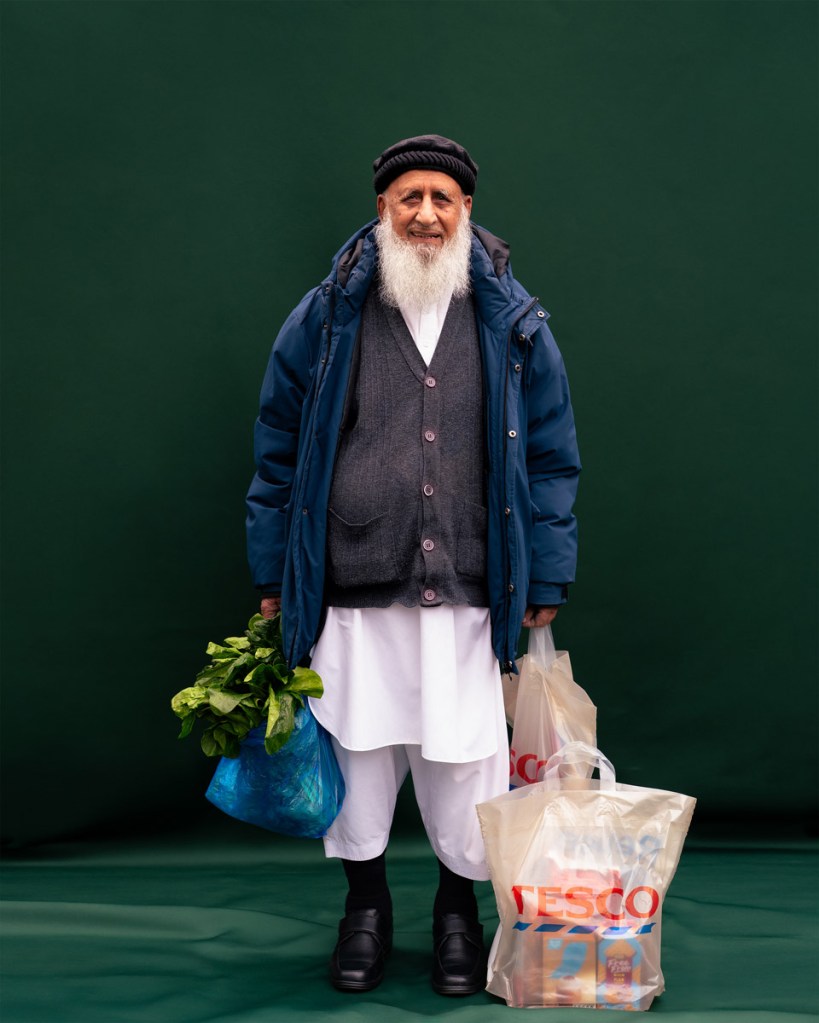 man stood with tesco bag for studio portrait