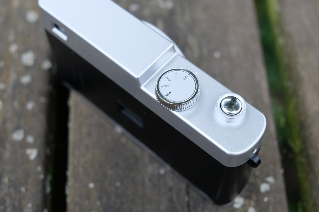 Photograph of the Camp Snap CS-PRO digital compact camera top plate showing mode dial and shutter button
