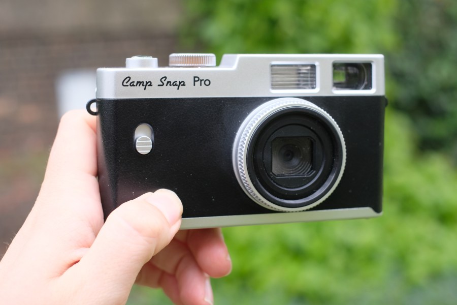 Photograph of the Camp Snap CS-PRO digital compact camera in hand facing front