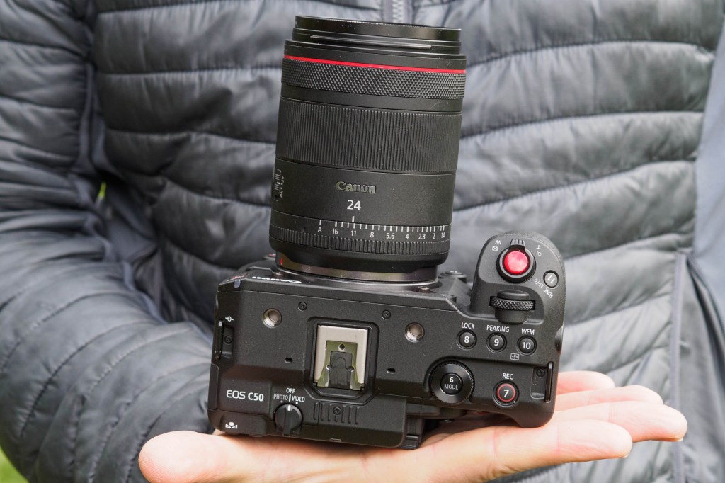 anon EOS C50 mirrorless camera in hand