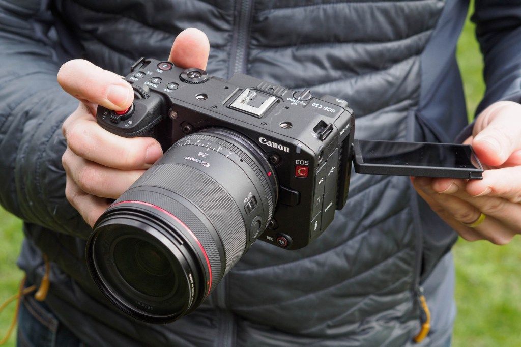 anon EOS C50 mirrorless camera in hand
