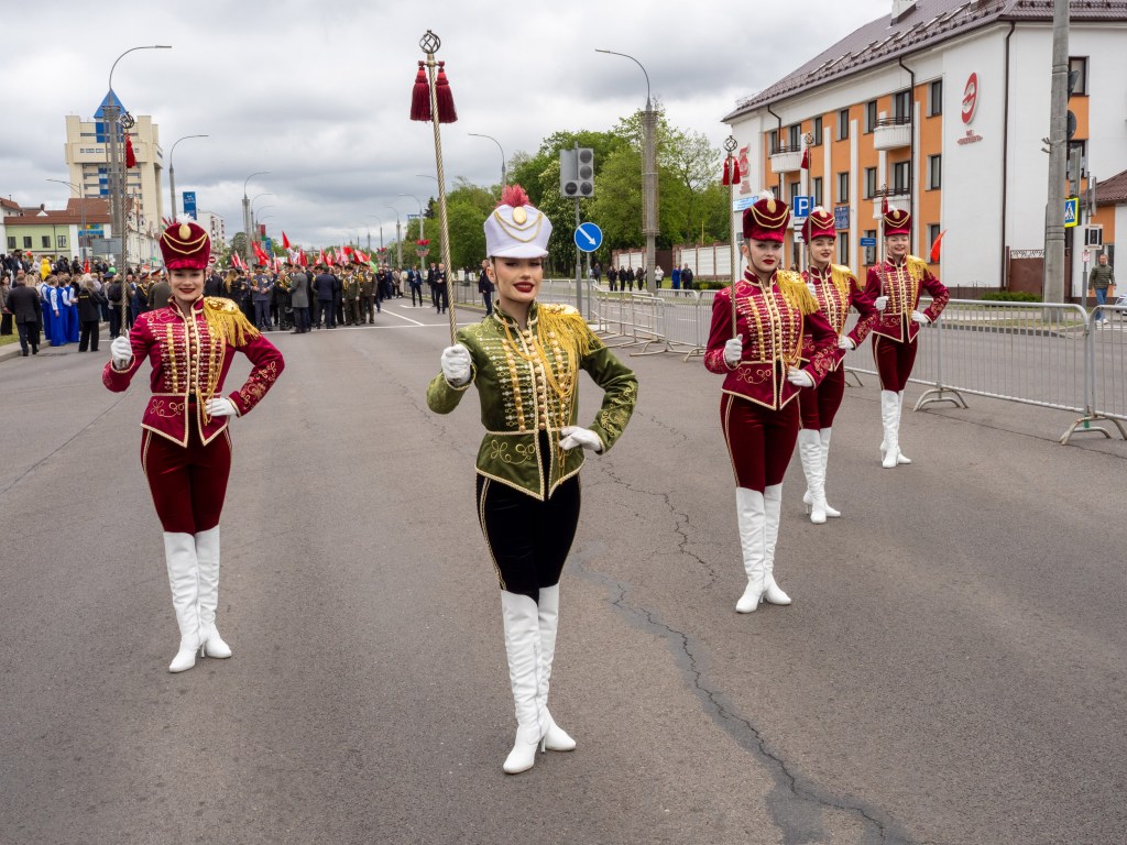 BREST, BELARUS - MAY 9, 2026: A troupe of majorettes perform alongside military personnel for the Victory Day parade. Image Credit: Peter Dench