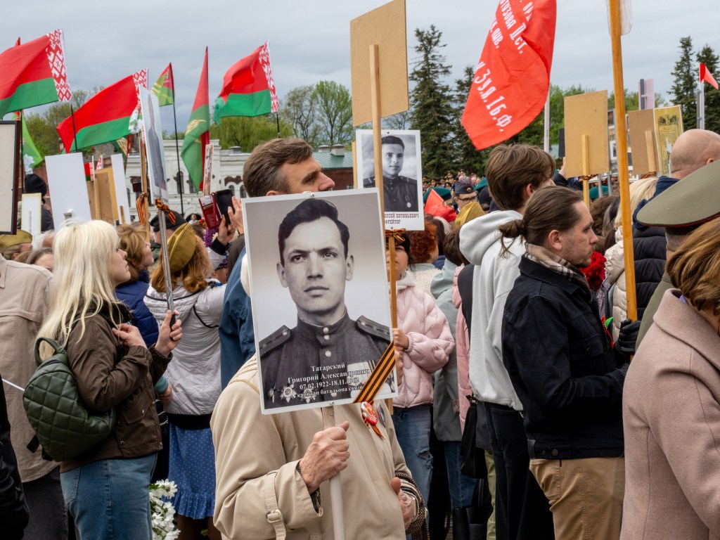 BREST, BELARUS - MAY 9, 2026: During the Victory Day commemorations crowds carry portraits of relatives who had served, disappeared or died in what is still referred to here as the Great Patriotic War. Image Credit: Peter Dench
