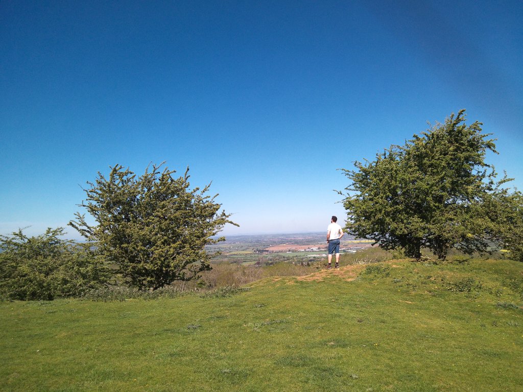 Sample image from Camp Snap CS-PRO, showing man standing on rural hilltop. There's some black banding visible in the upper right