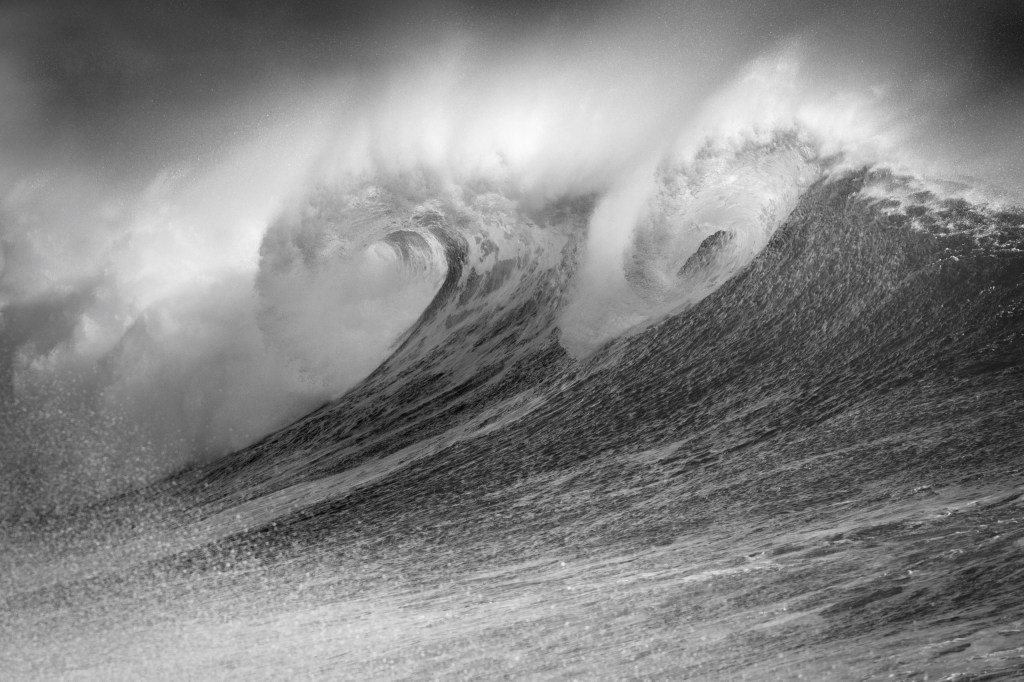 black and white photo of two big waves