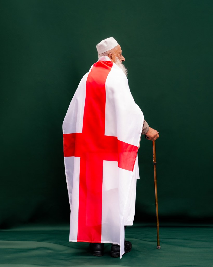 Ghulam Abbas wearing the st georges flag as a cape