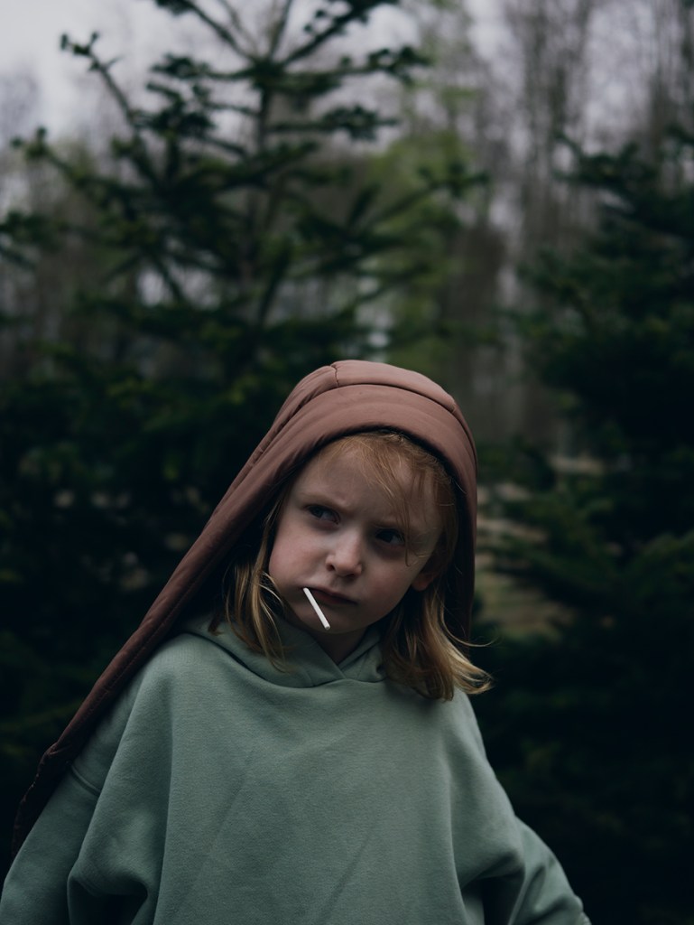 portrait of a young girl with a hood over her head