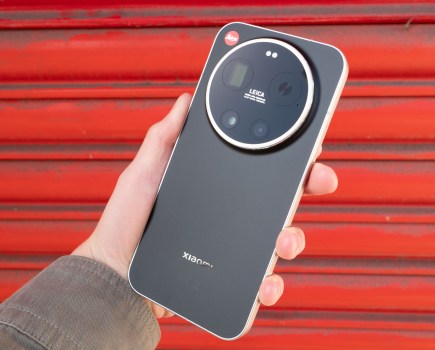 The Leica Leitzphone in hand in front of some red shutters