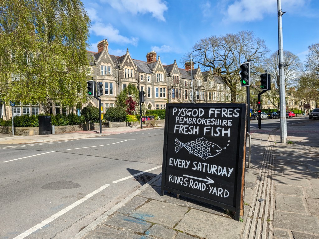 An image of a sign advertising a fresh fish market