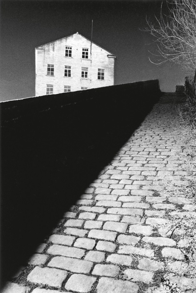 Bill Brandt’s Snicket, Halifax, Yorkshire, England. 1986 © Michael Kenna, 2026