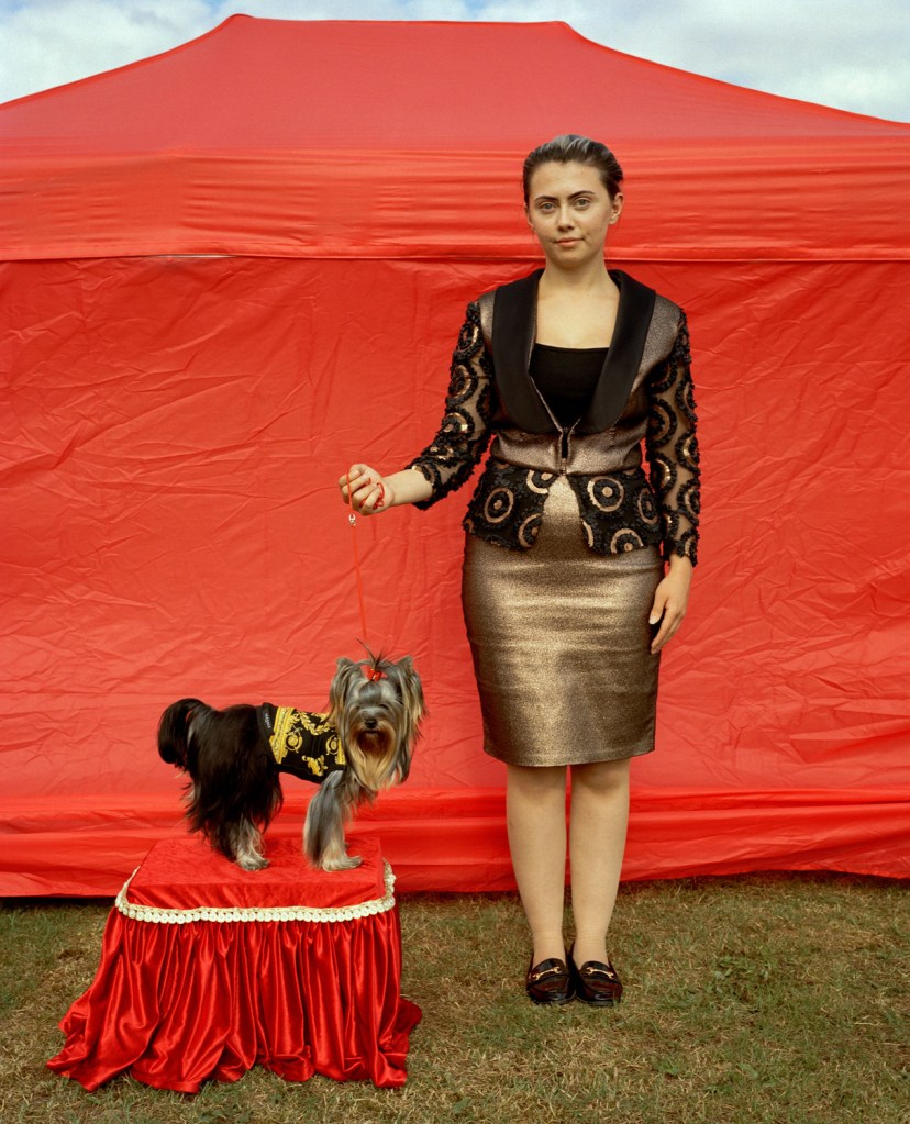 dog and owner posing at a dog show