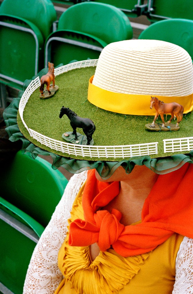 elaborate ladies hat with horse figurines on the brim