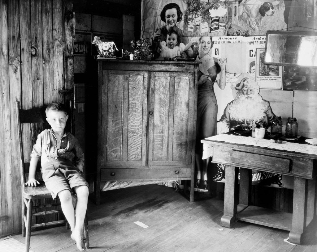 child sitting on a wooden chair