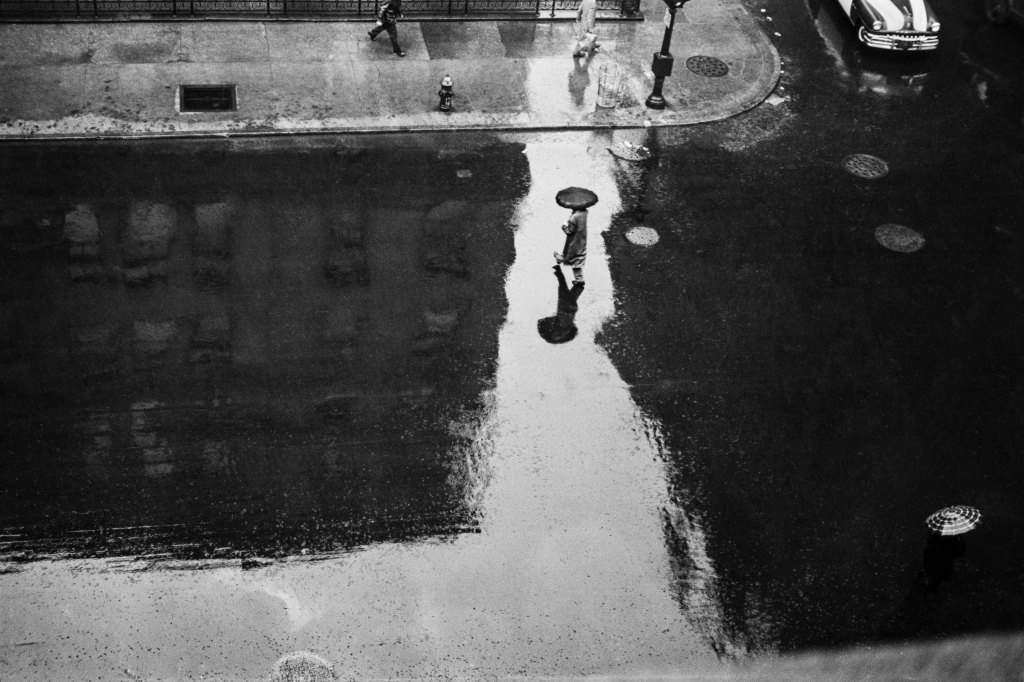 JOHN BAER The Extraordinary Ordinary: A Memoir in Photographs 1945-1954. John Baer, Rainy Day Reflections, Lexington Avenue, Manhattan from JOHN BAER The Extraordinary Ordinary: A Memoir in Photographs 1945-1954.