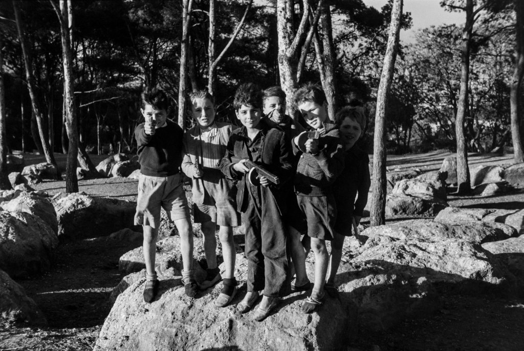 JOHN BAER The Extraordinary Ordinary: A Memoir in Photographs 1945-1954. John Baer, Boys with Wooden Guns, Barcelona, 1951, from JOHN BAER The Extraordinary Ordinary: A Memoir in Photographs 1945-1954.