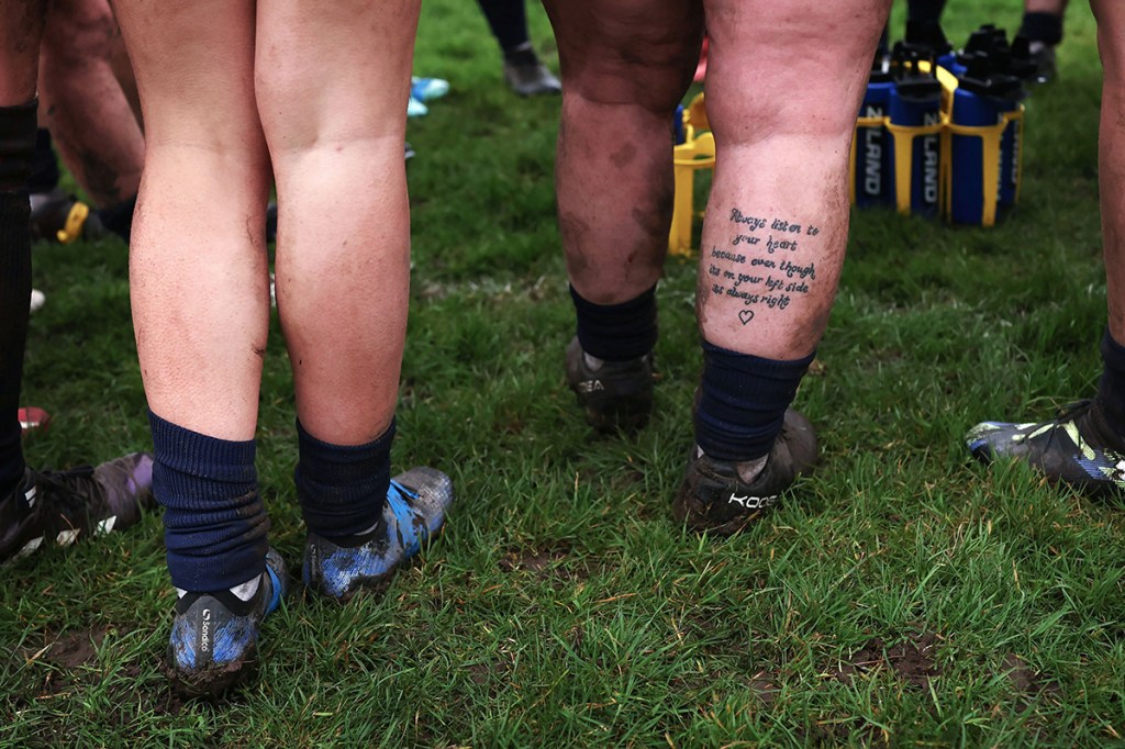 photo of a tattoo of text on the back of a leg