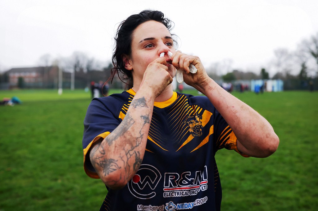 woman holding tampons in her nose