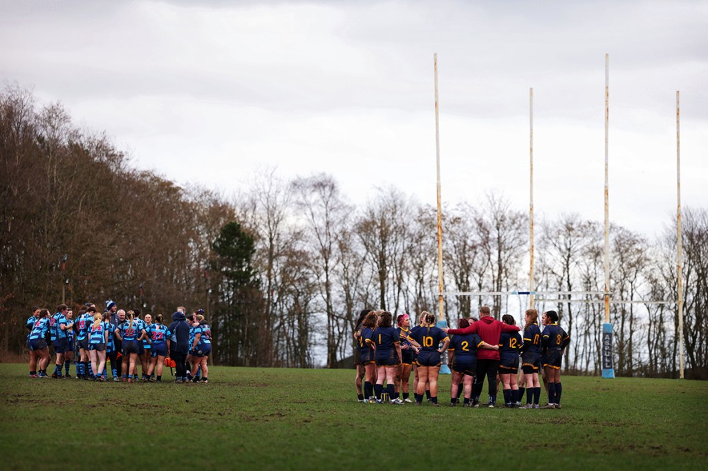 women rugby players on a pitch