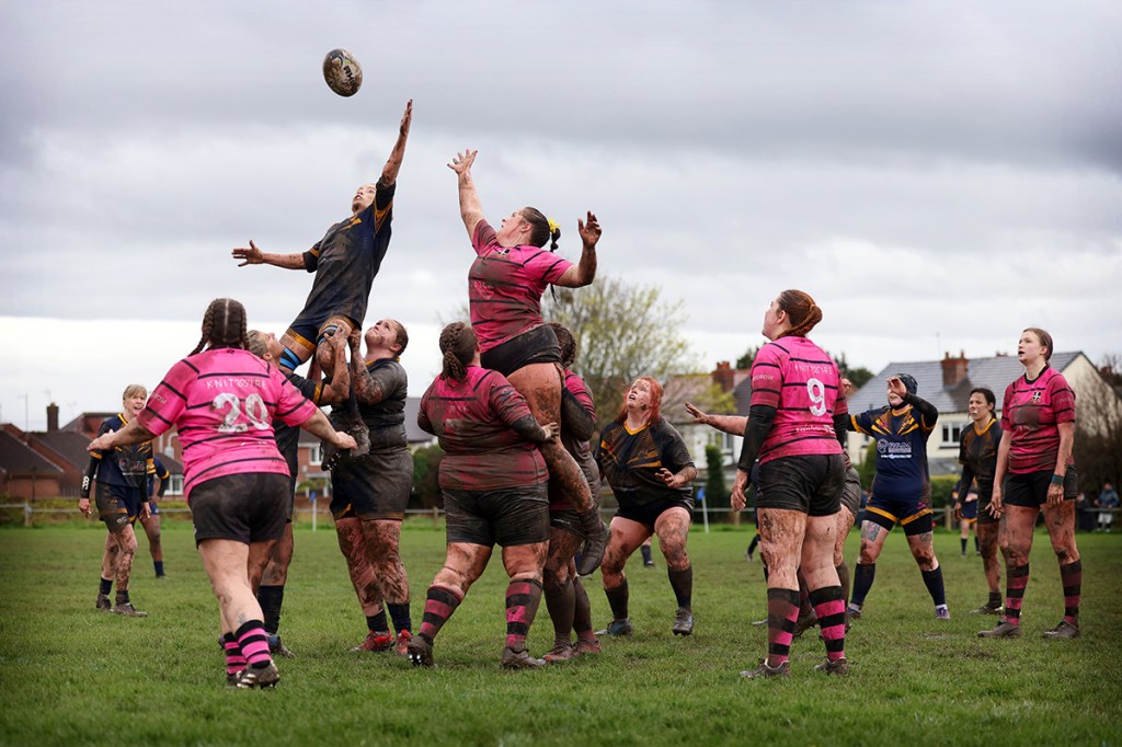 women playing rugby