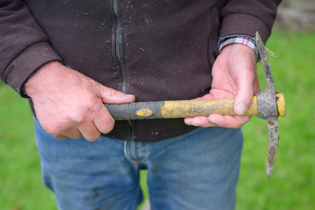 Farmer holding a pickaxe