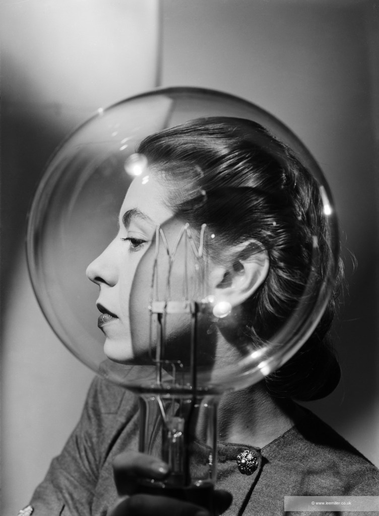 Model with lightbulb, London, England, c1943.