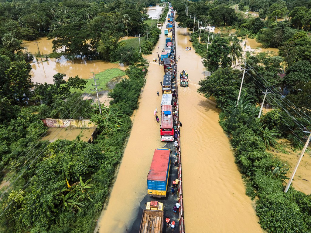 An aerial view shows traffic moving slowly along the flooded Dhaka–Chattogram highway in Feni district, Bangladesh, on August 22, 2024, after flash floods disrupted transportation.