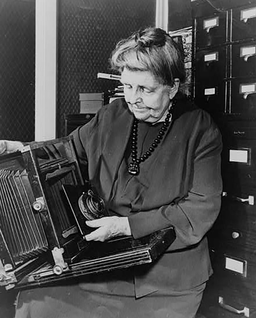 Frances Benjamin Johnston with a camera