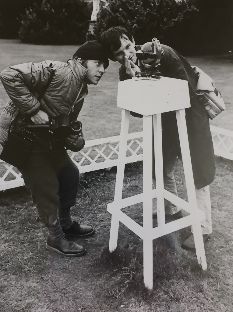 two people looking at a camera