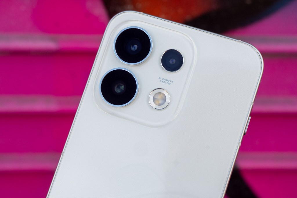 Close up of Oppo Reno 16 Pro against a pink background