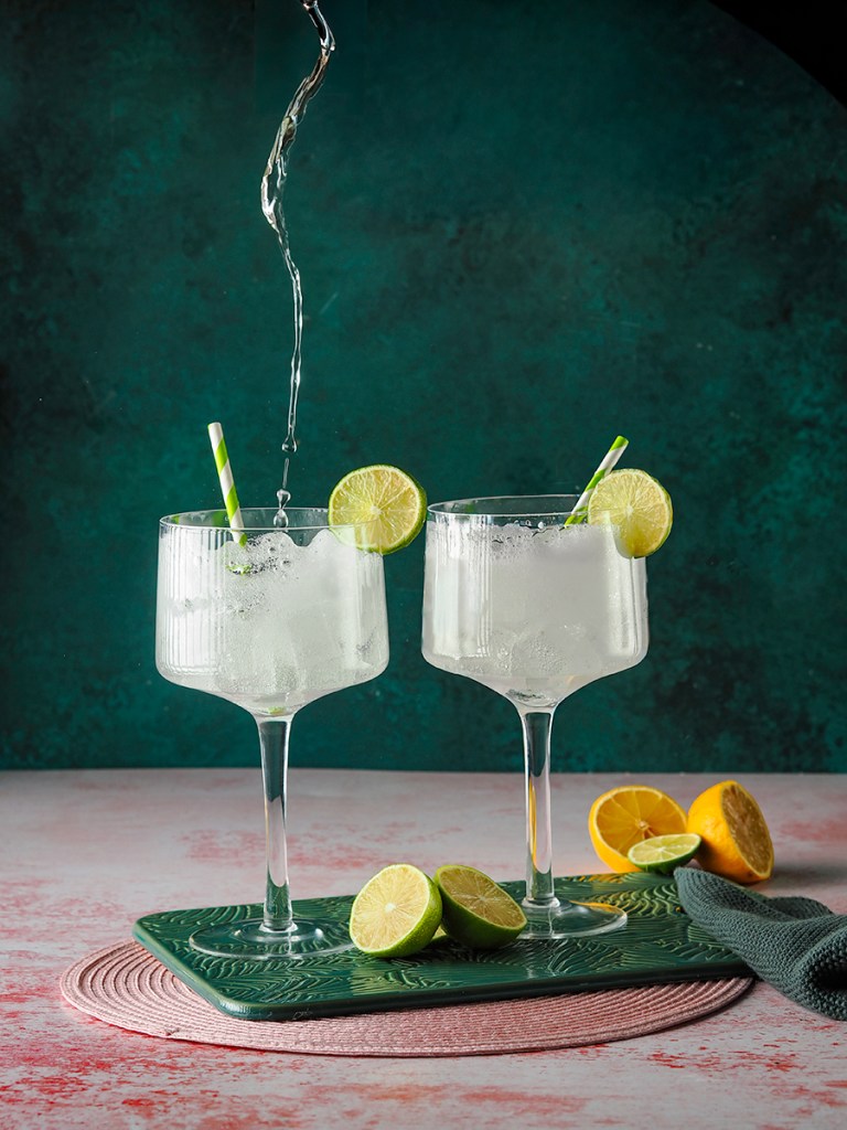 photo of two gin and tonic glasses filled up