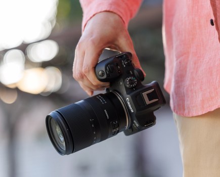 Tamron 17-70mm F/2.8 Di III-A VC RXD mounted on a Canon camera held by a person wearing a pink shirt