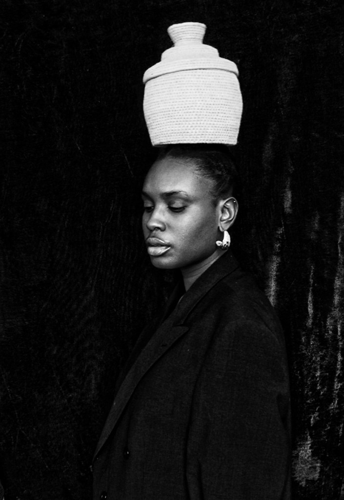 “The Weight of It All” explores the generational trauma being passed down from a 
generation to another. This self-portrait presents strength as a learned survival instinct 
that feels burdensome and weary at time.