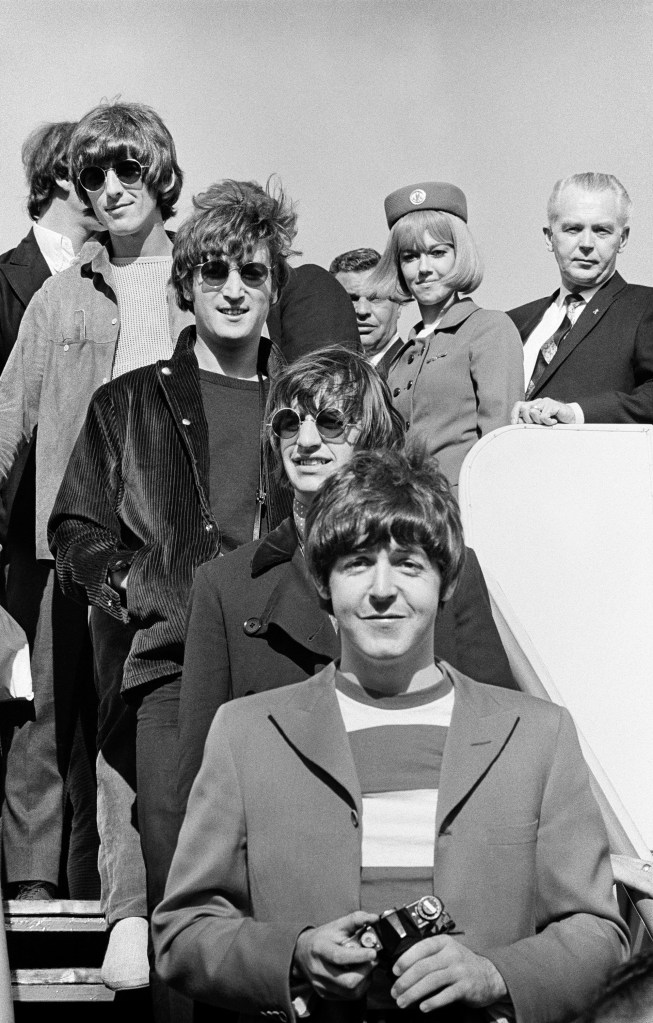 The Beatles disembark at San Francisco International Airport.  Image Credit: 2026 © Jim Marshall