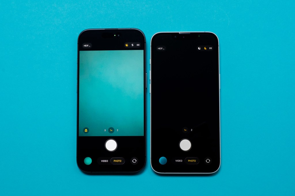 iPhone 17 and iPhone 17e native camera app side by side on a blue surface
