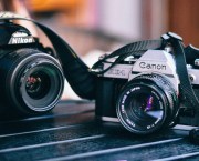 Old cameras from Nikon and Canon. Image: Rosalind Chang, Unsplash