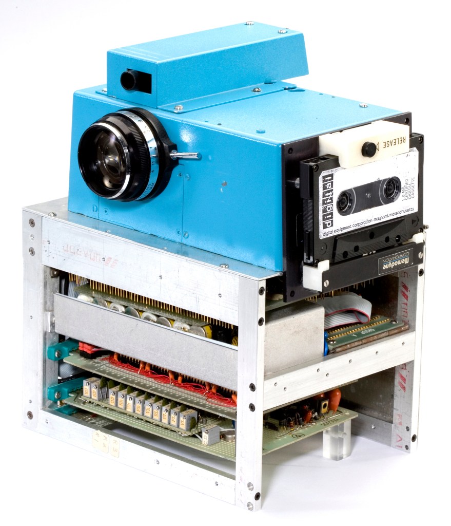 The first digital camera used six circuit boards, 16 nickel cadmium batteries, an analogue/digital converter salvaged from a digital voltmeter, the discarded lens from an old Super-8 movie camera and a portable digital cassette instrumentation recorder. In today’s jargon it would be called a 0.01 megapixel camera
(Courtesy of Steven Sasson)