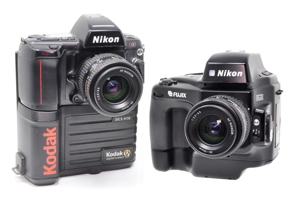 Two early attempts at building DSLRs: a Kodak DCS 410, which mounted Kodak digital technology on a Nikon N90 SLR (left), with a Nikon E2, made more bulky than most to allow room for its reduction optics technology