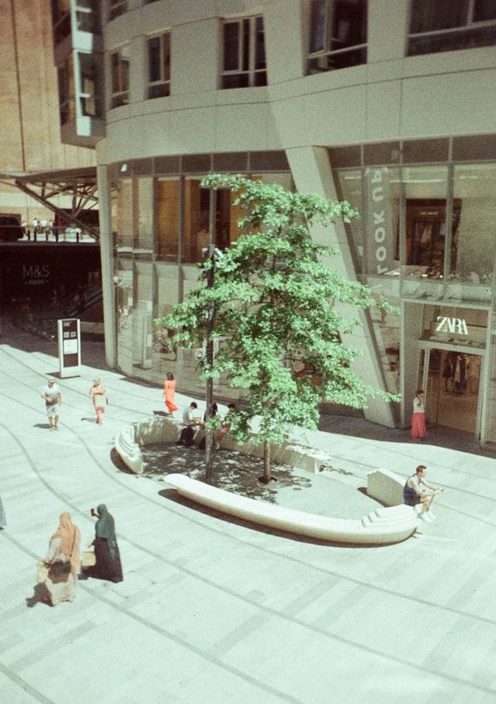 Sample photograph from the Lomography Half-frame Simple Use Camera, shot on LomoChrom Classicolor 200 film showing a view of a shopping plaza from above