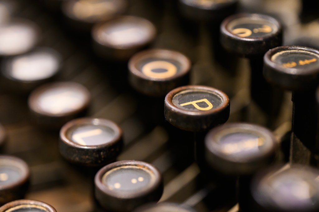 Tamron 90mm F2.8 Di III Macro VXD lens sample image. A typewriter's keys from up sloce