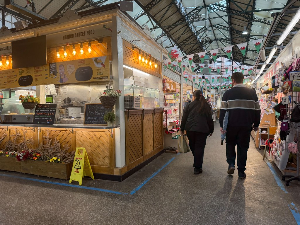 Two people in a covered market