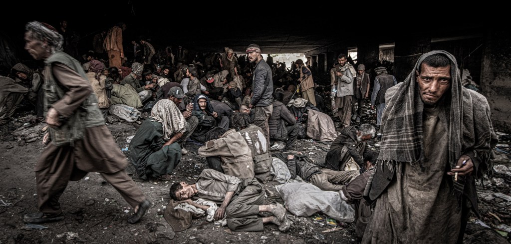 There are an estimated 6 million drug addicts in Afghanistan, a problem that is only becoming worse since the Taliban have again taken control. Some the estimated 1000 drug addicts at the Pul-e-Sukhta bridge, Kabul. Image Credit © Simon Townsley