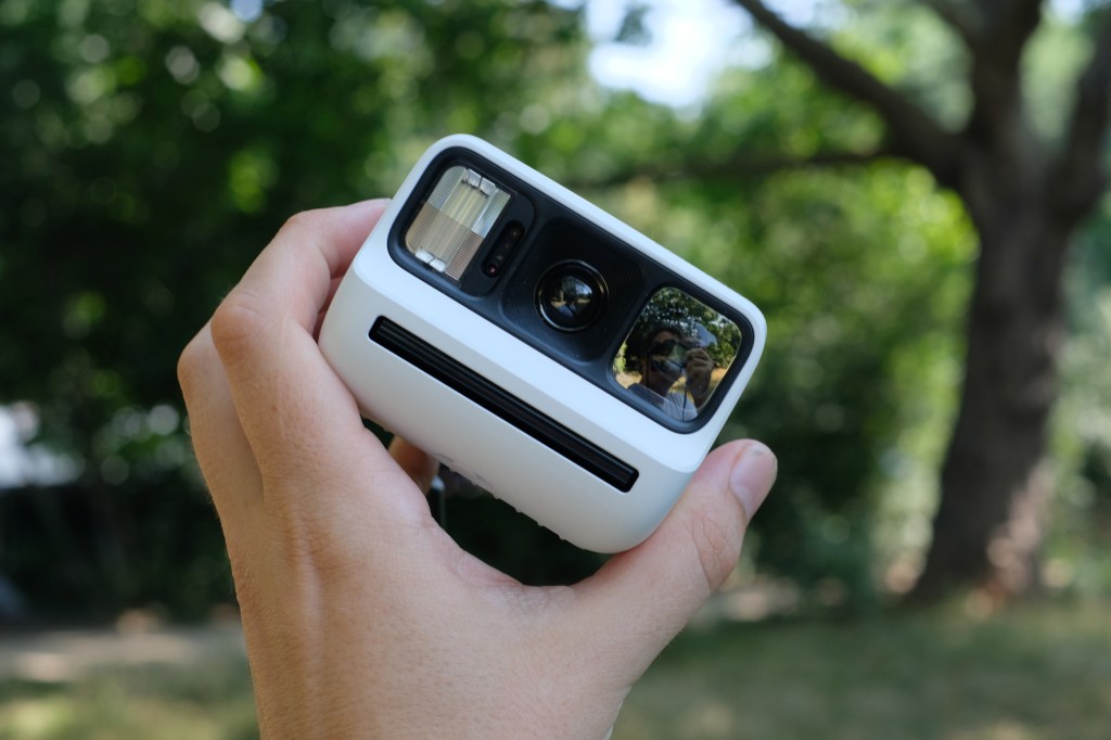 Photograph of the small Polaroid Go Gen 3 held in a man's hand