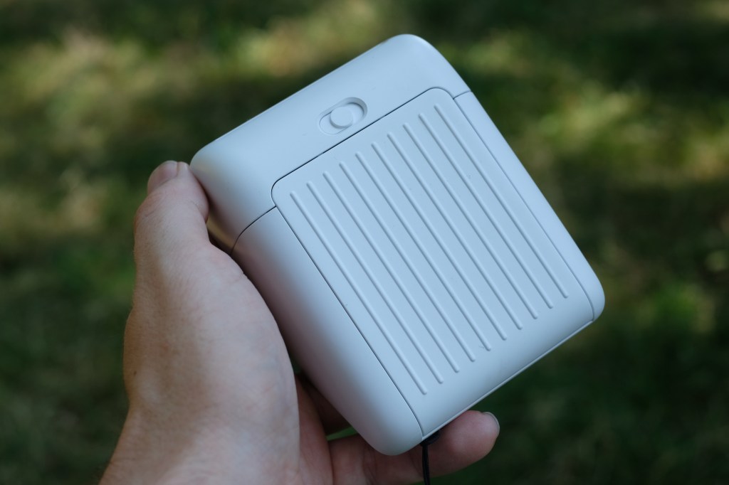 Photograph of the small Polaroid Go Gen 3 held in a man's hand