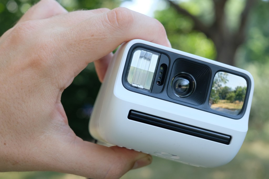 Photograph of the small Polaroid Go Gen 3 held in a man's hand