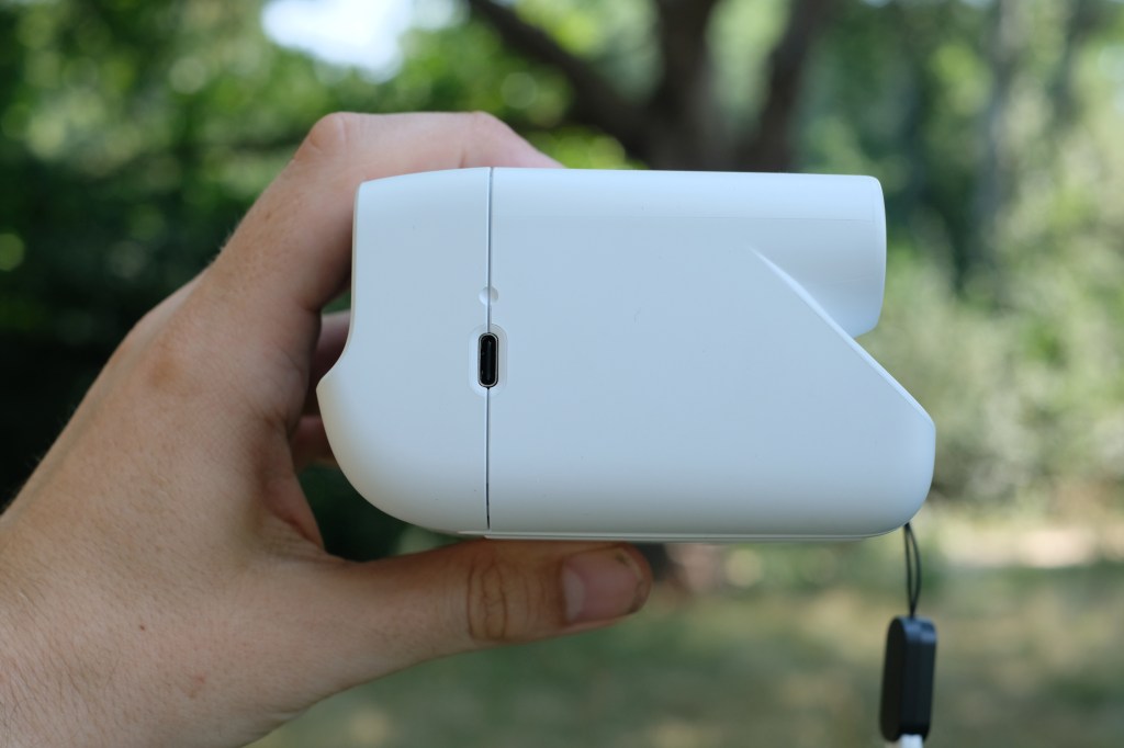 Photograph of the small Polaroid Go Gen 3 held in a man's hand