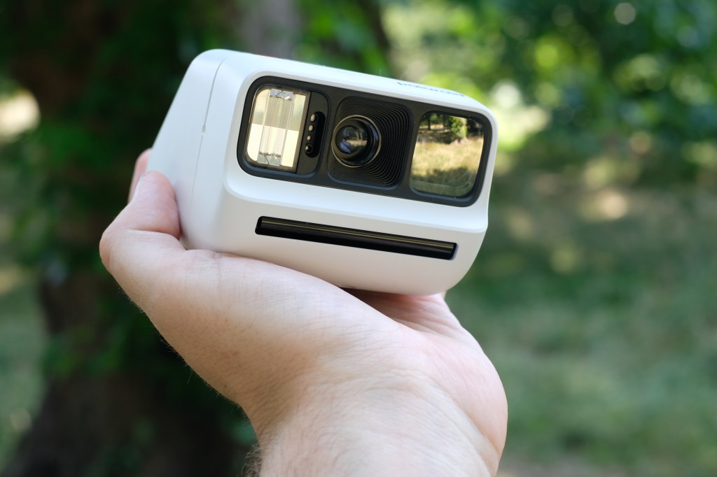 Photograph of the small Polaroid Go Gen 3 held in a man's hand