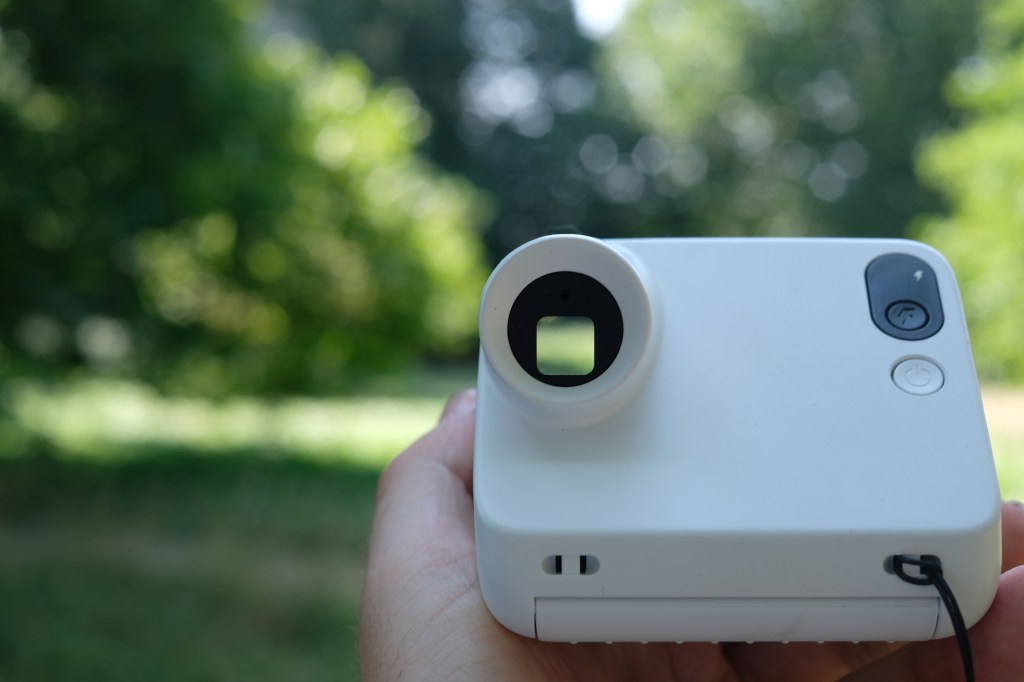 Photograph of the small Polaroid Go Gen 3 held in a man's hand