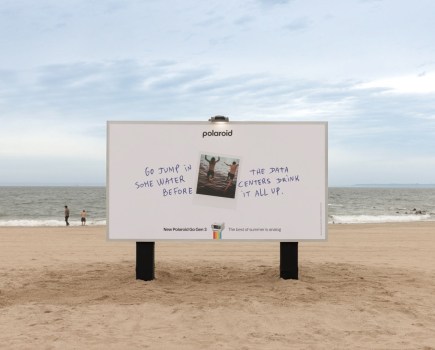 Polaroid campaign summer 2026. Billboard on a beach